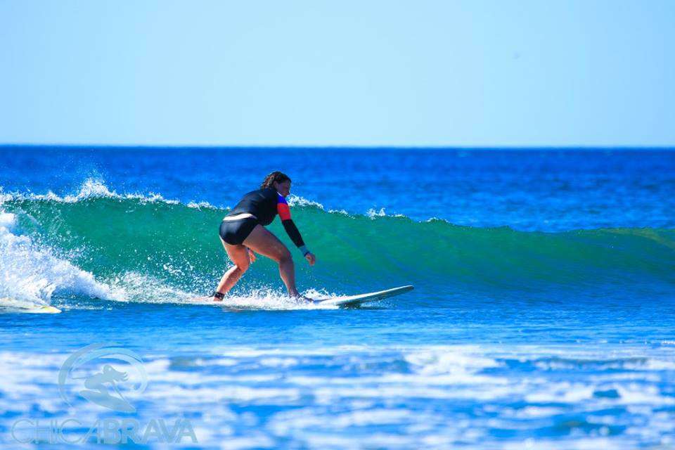 woman surfing a wave in Nicaragua at Chica Brava Surf retreat