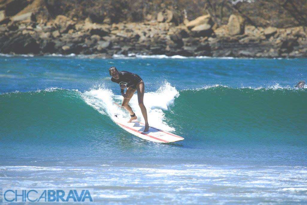 Woman dropping in on a wave in Nicaragua.